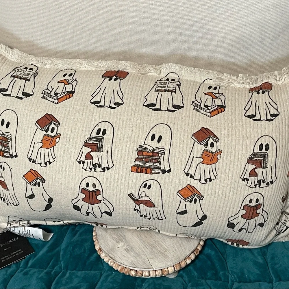 Ghost reading book pillow by Cynthia Rowley